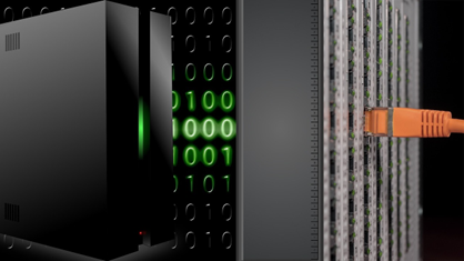 Image of an orange cord plugged into a server.