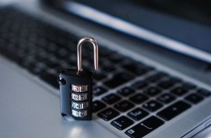 Image of a padlock in front of a laptop, symbolizing online security.