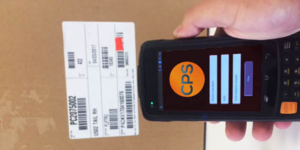 Image of a barcode scanner in action; an app developed by Creative Programs and Systems.