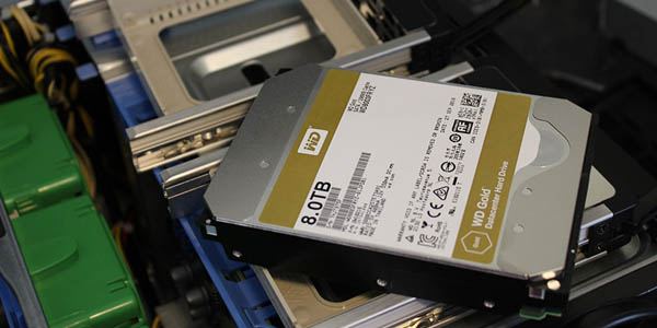 Image of a hard drive resting on a server to reference how Creative Programs and Systems provides data recovery services. 